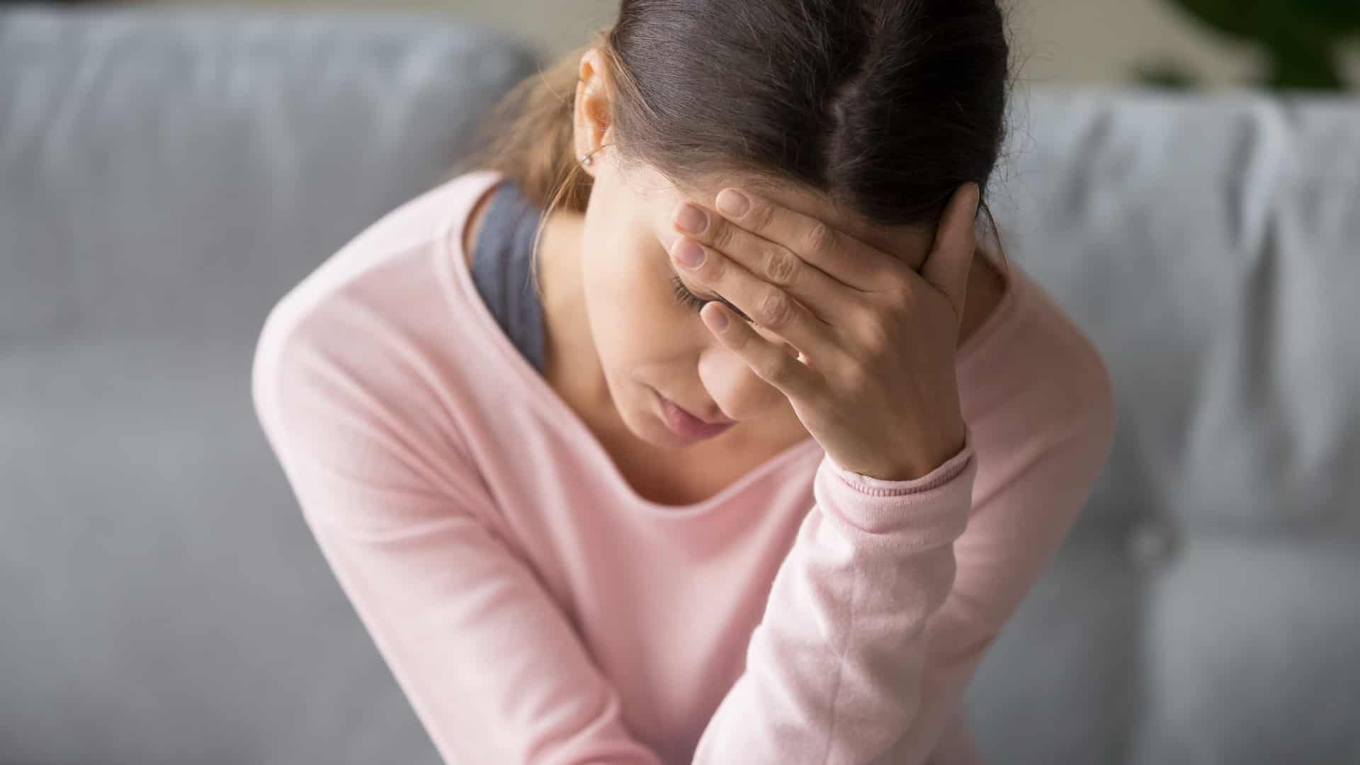 Photo of a Woman Suffering from Headache
