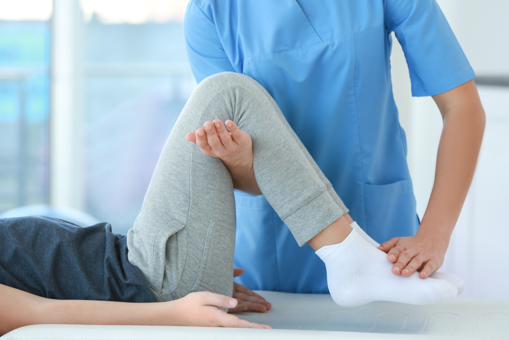 Photo of Physiotherapist Working with Patient in Pectineus Muscle Strain